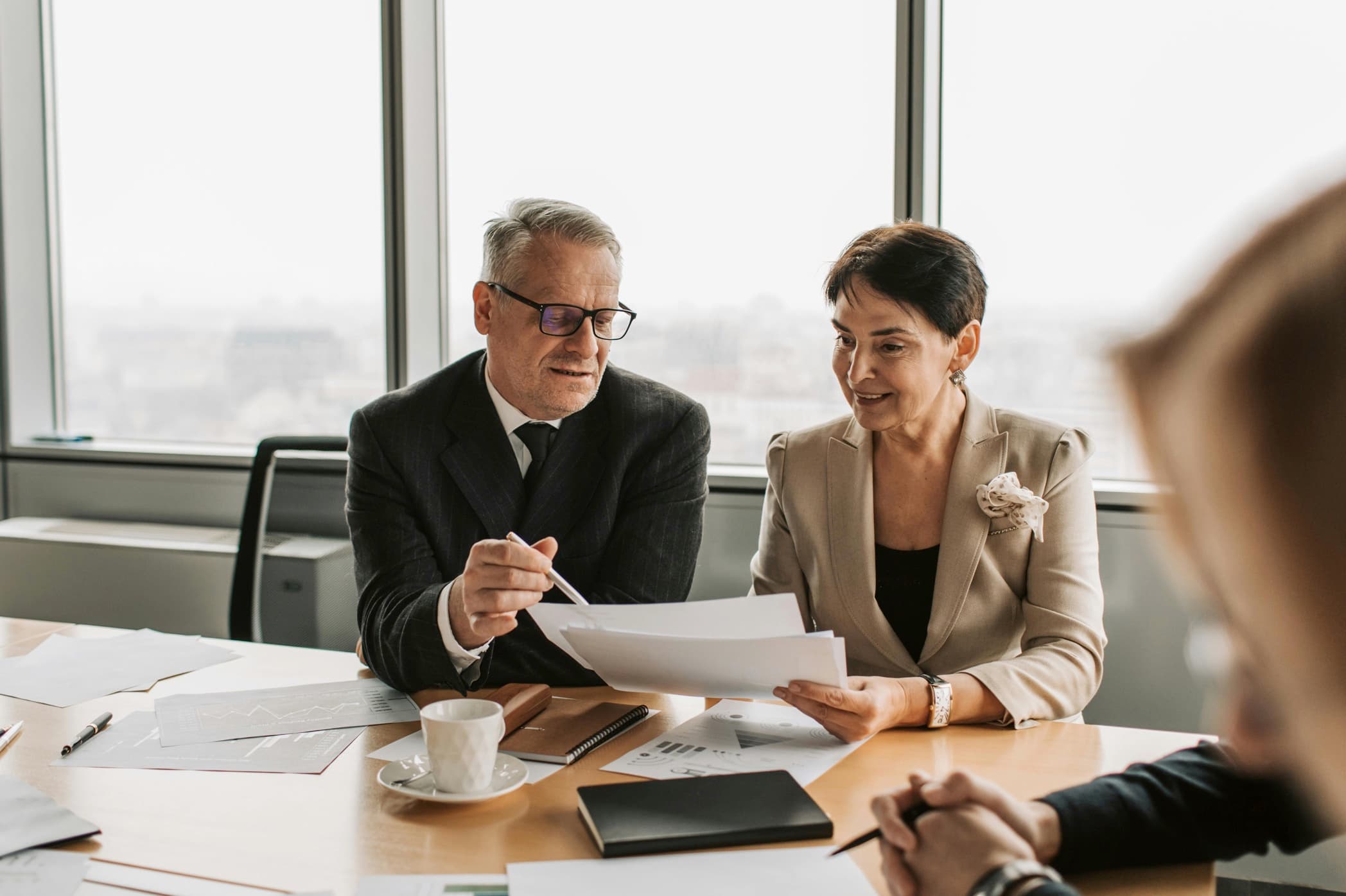 A quiet boardroom with papers laid out on the table